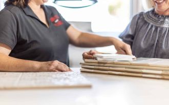 showing tile to a customer