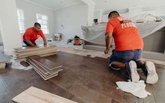 dukes team installing vinyl flooring