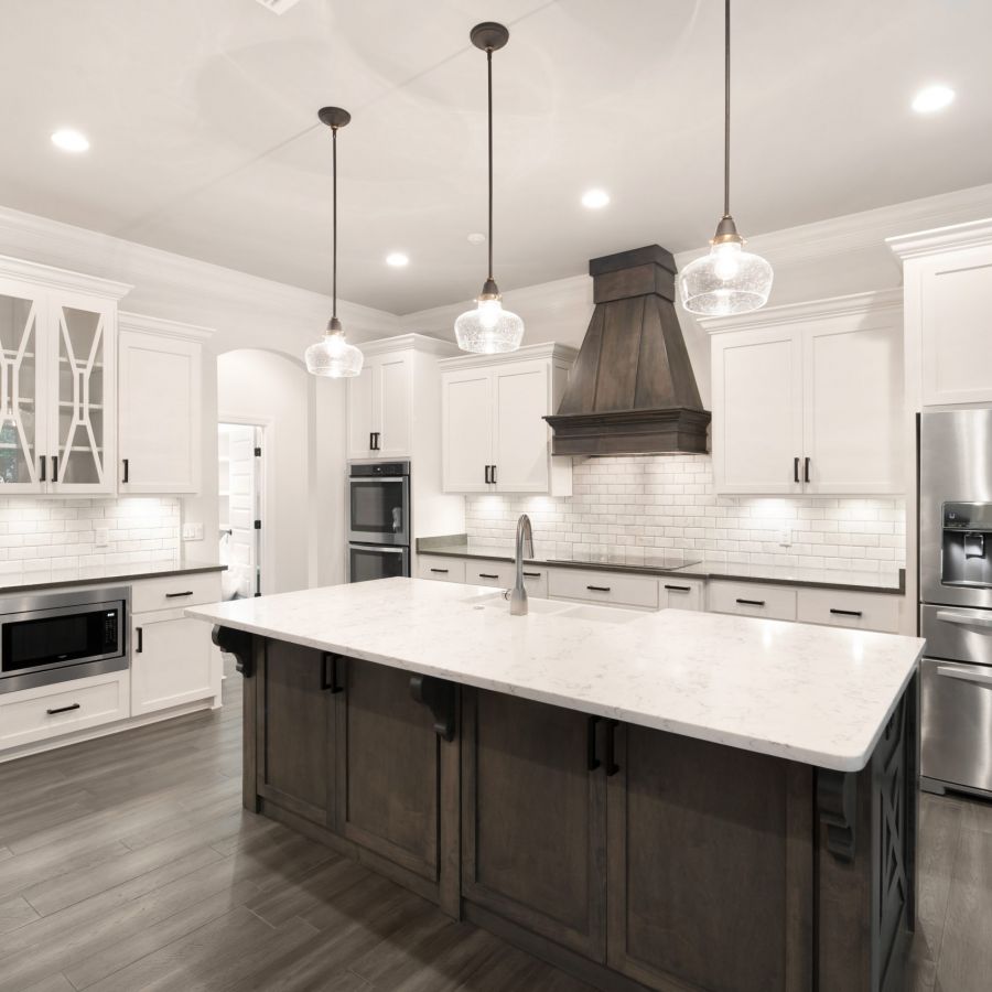 gray laminate flooring in an open kitchen with an island